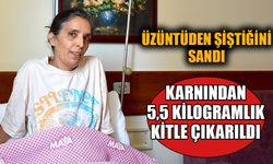 Üzüntüden şiştiğini düşündüğü karnından 5,5 kilogramlık kitle çıkarıldı