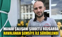 Manav çalışanı şiddetli rüzgarda havalanan şemsiye ile sürüklendi