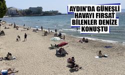 Aydın'da güneşli havayı fırsat bilenler denize konuştu